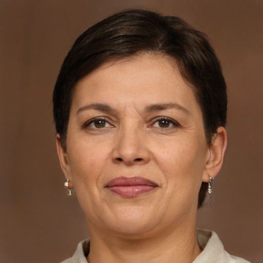 Joyful white adult female with short  brown hair and brown eyes