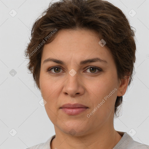 Joyful white adult female with short  brown hair and brown eyes