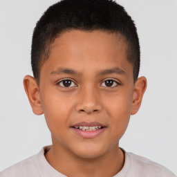 Joyful white child male with short  brown hair and brown eyes