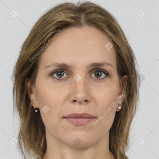 Joyful white adult female with medium  brown hair and grey eyes