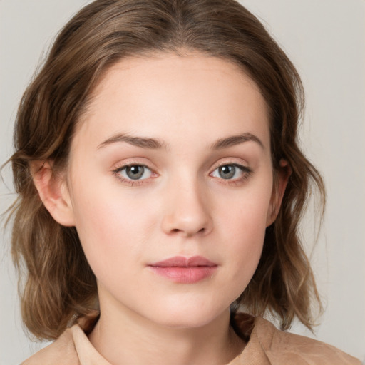 Neutral white young-adult female with medium  brown hair and green eyes