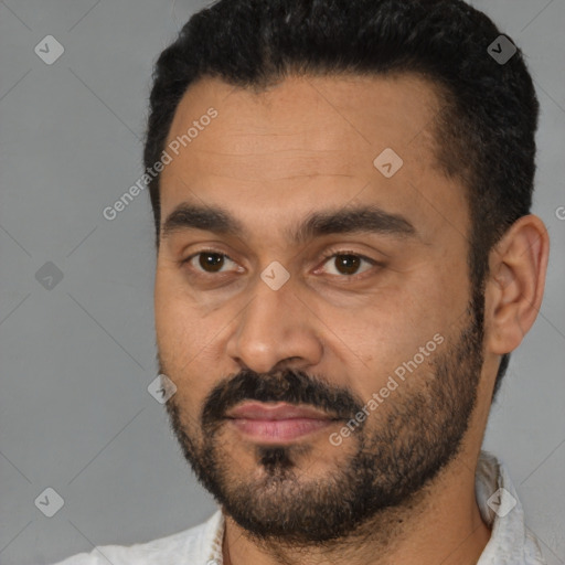 Joyful latino adult male with short  black hair and brown eyes