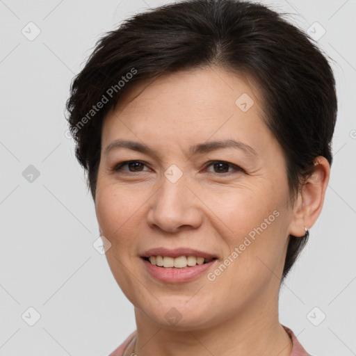 Joyful white adult female with short  brown hair and brown eyes