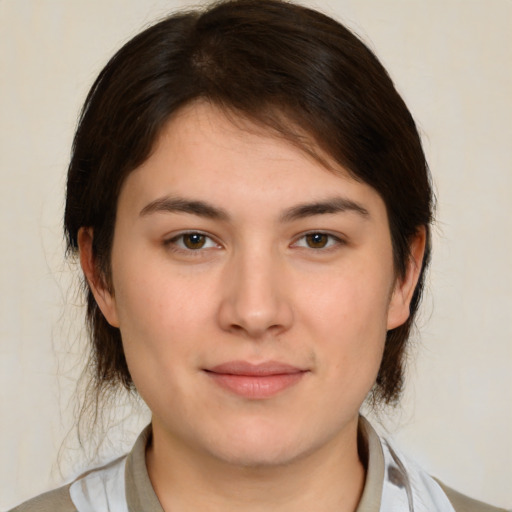 Joyful white young-adult female with medium  brown hair and brown eyes