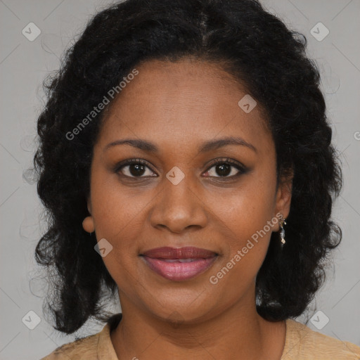 Joyful black young-adult female with long  brown hair and brown eyes