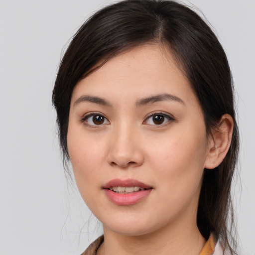 Joyful white young-adult female with medium  brown hair and brown eyes