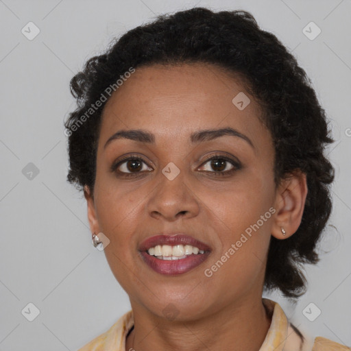 Joyful black young-adult female with medium  brown hair and brown eyes