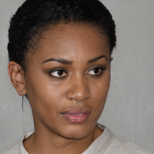 Neutral black young-adult female with short  brown hair and brown eyes