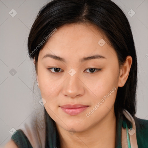 Joyful asian young-adult female with long  brown hair and brown eyes