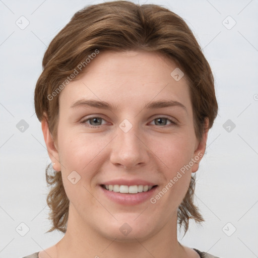 Joyful white young-adult female with medium  brown hair and grey eyes