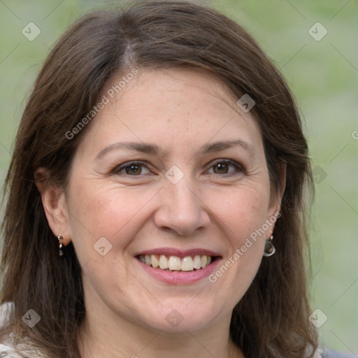 Joyful white adult female with medium  brown hair and grey eyes