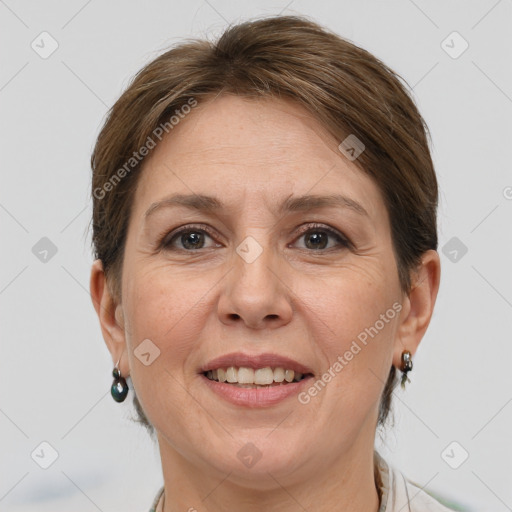 Joyful white adult female with short  brown hair and grey eyes