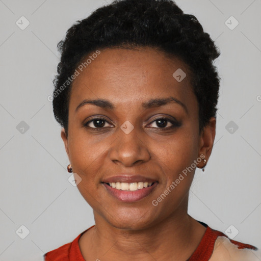 Joyful black young-adult female with short  black hair and brown eyes