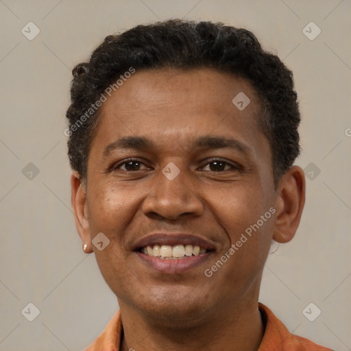 Joyful latino young-adult male with short  brown hair and brown eyes