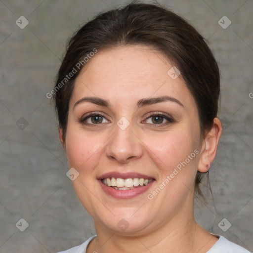 Joyful white adult female with short  brown hair and brown eyes