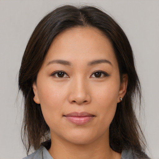 Neutral asian young-adult female with medium  brown hair and brown eyes