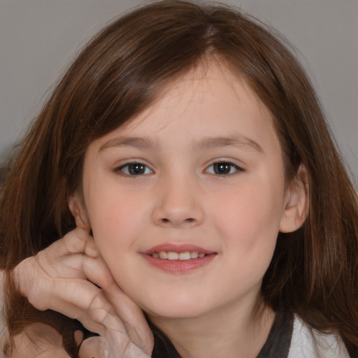 Joyful white child female with medium  brown hair and brown eyes