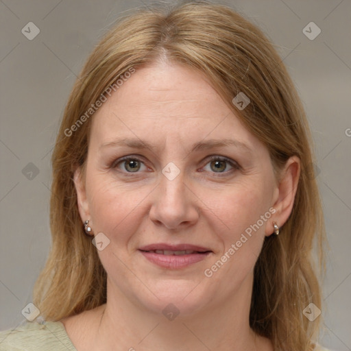 Joyful white adult female with medium  brown hair and grey eyes