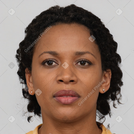 Neutral black young-adult female with medium  brown hair and brown eyes