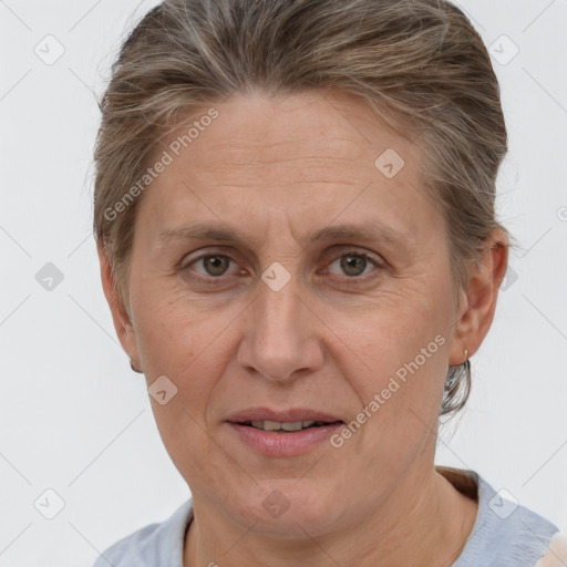 Joyful white adult female with short  brown hair and grey eyes