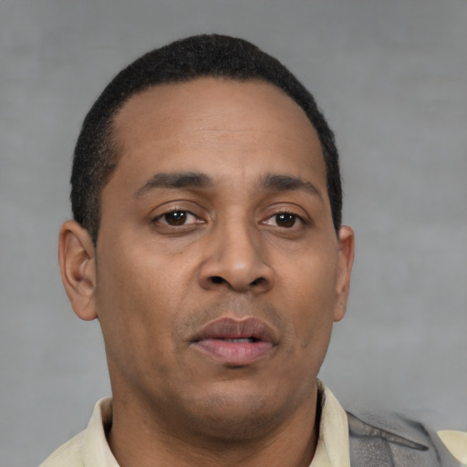 Neutral latino young-adult male with short  brown hair and brown eyes