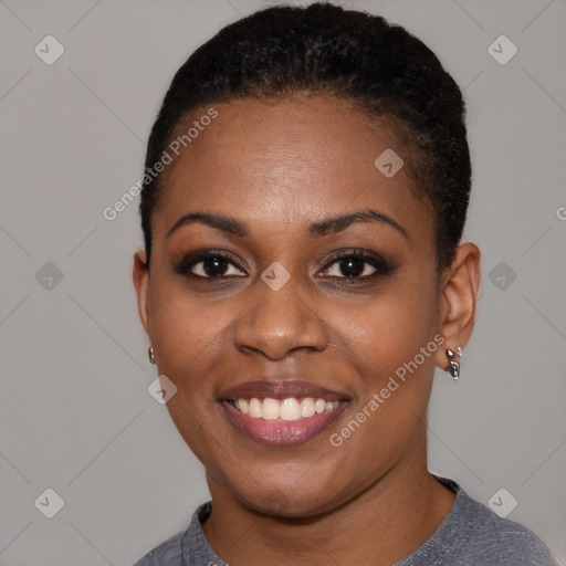 Joyful black young-adult female with short  brown hair and brown eyes