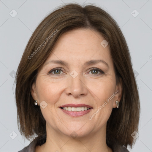 Joyful white adult female with medium  brown hair and grey eyes