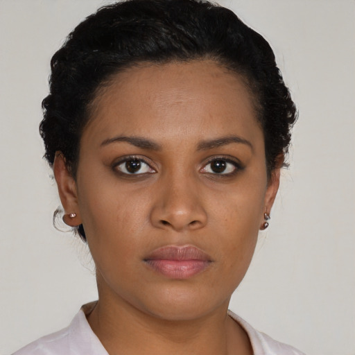 Neutral black young-adult female with short  black hair and brown eyes