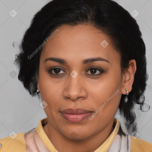 Joyful latino adult female with medium  brown hair and brown eyes