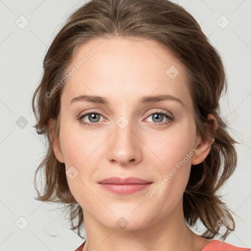 Joyful white young-adult female with medium  brown hair and blue eyes