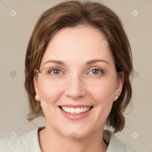 Joyful white young-adult female with medium  brown hair and green eyes