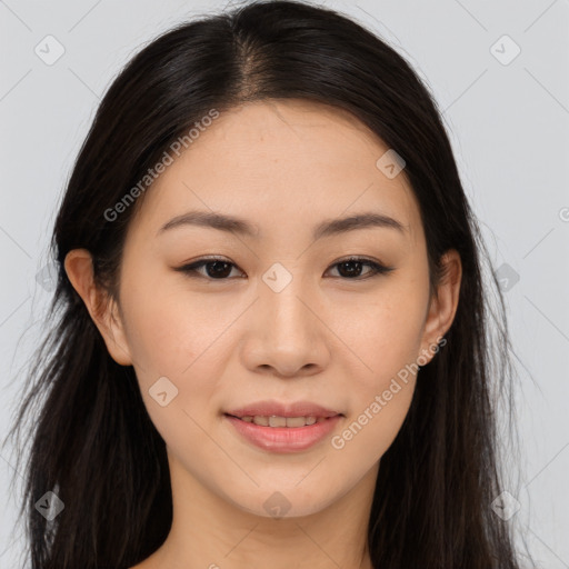 Joyful asian young-adult female with long  brown hair and brown eyes