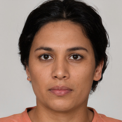 Neutral white young-adult female with short  brown hair and brown eyes