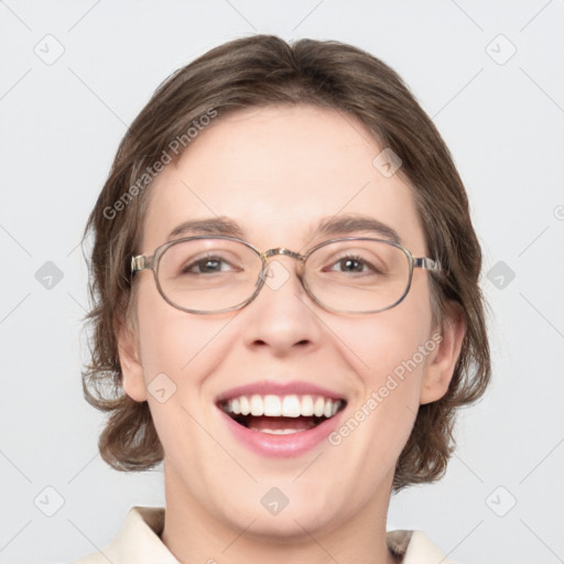 Joyful white adult female with medium  brown hair and green eyes