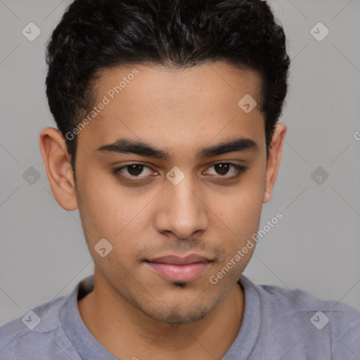 Joyful latino young-adult male with short  brown hair and brown eyes