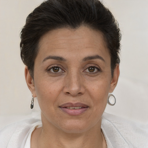 Joyful white adult female with short  brown hair and brown eyes