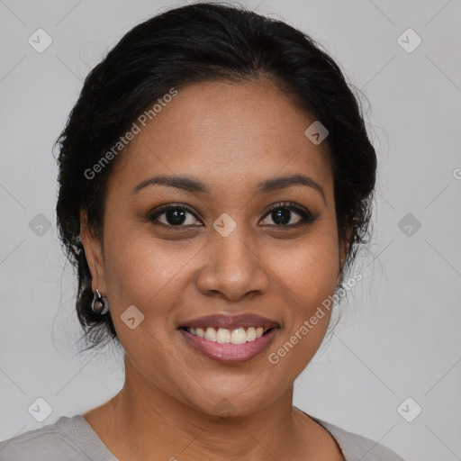 Joyful latino young-adult female with medium  brown hair and brown eyes