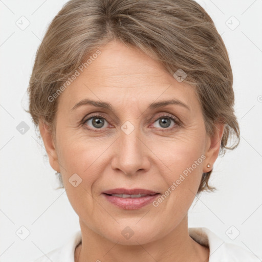 Joyful white adult female with short  brown hair and grey eyes