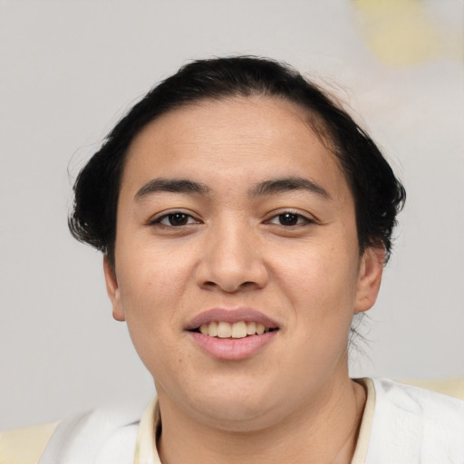 Joyful asian young-adult female with short  brown hair and brown eyes