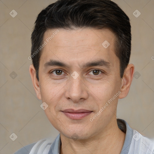 Joyful white adult male with short  brown hair and brown eyes