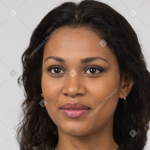 Joyful black young-adult female with long  brown hair and brown eyes