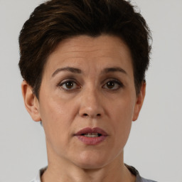 Joyful white adult female with short  brown hair and brown eyes