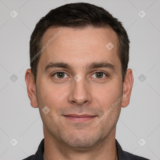 Joyful white adult male with short  brown hair and brown eyes