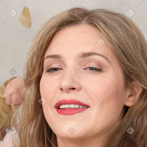 Joyful white adult female with long  brown hair and brown eyes