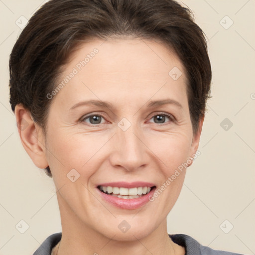 Joyful white adult female with short  brown hair and brown eyes