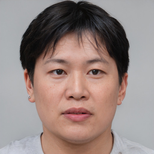 Neutral asian young-adult male with short  brown hair and brown eyes