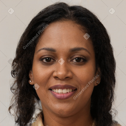 Joyful black young-adult female with long  brown hair and brown eyes