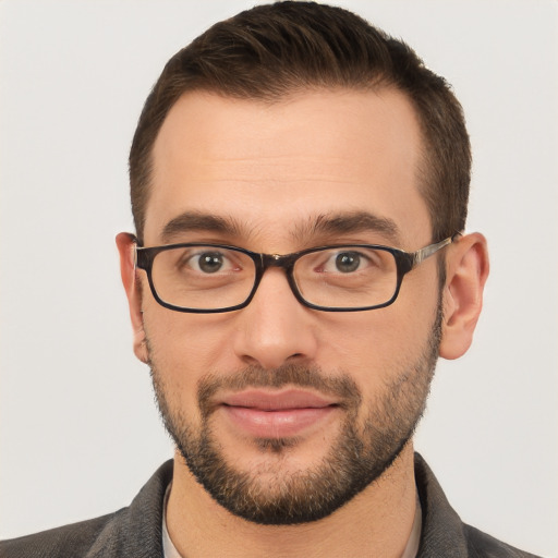 Joyful white young-adult male with short  brown hair and brown eyes