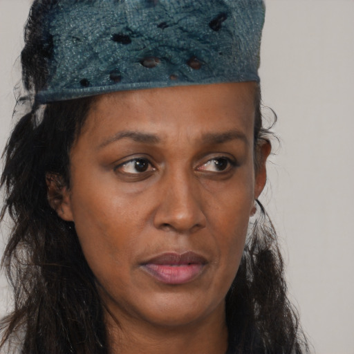 Neutral black young-adult female with long  brown hair and brown eyes