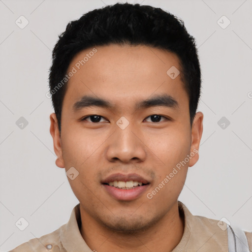 Joyful asian young-adult male with short  black hair and brown eyes